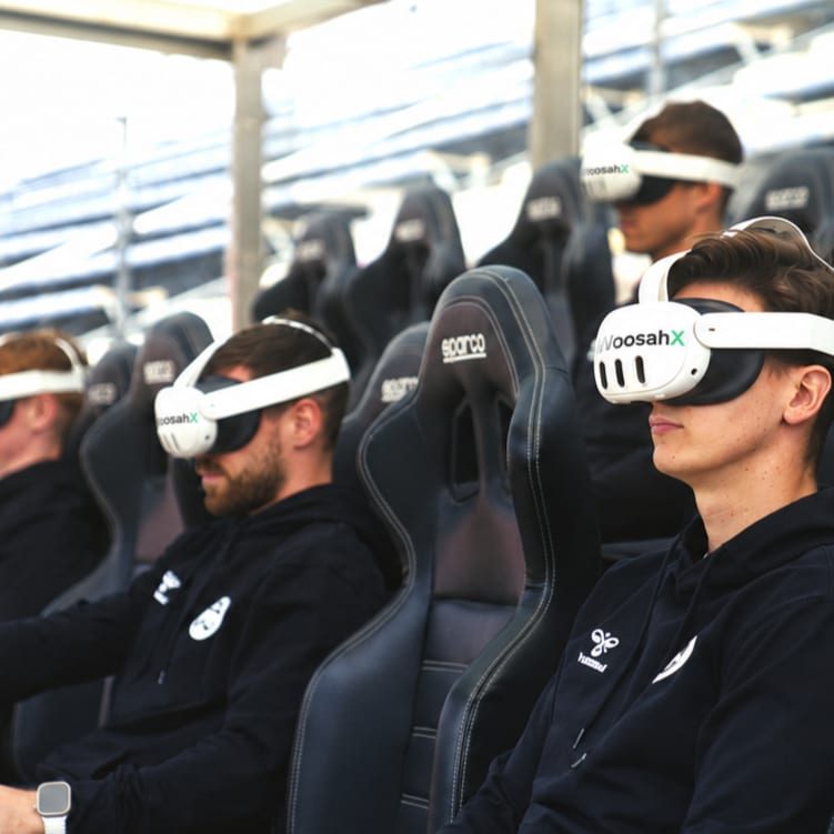 Athletes using WoosahX VR headsets in stadium seating
