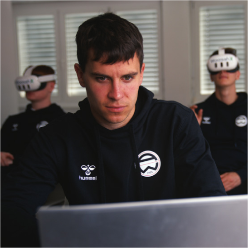 Athlete using WoosahX at a laptop